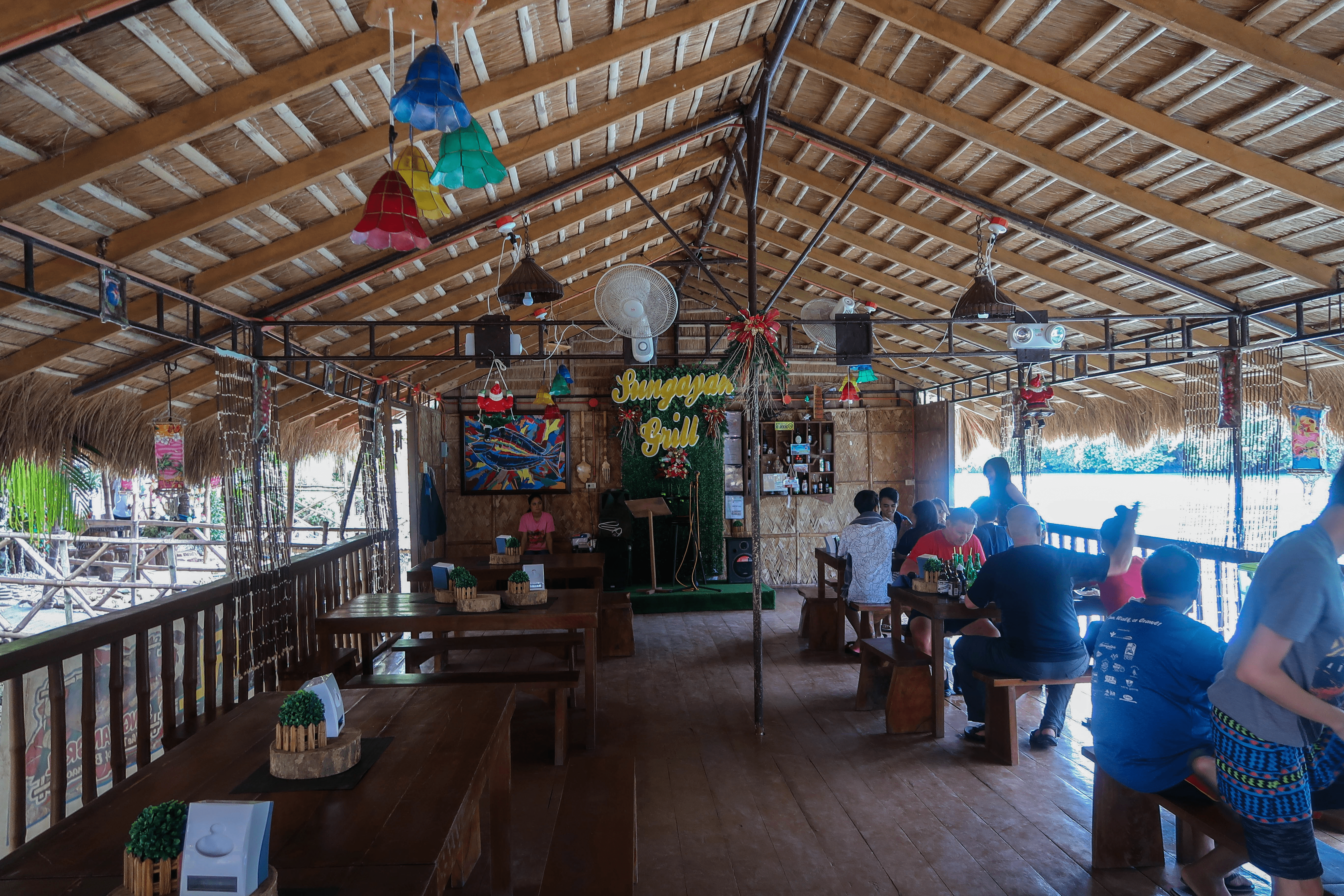 sungayan grill floating restaurant in bolinao pangasinan philippines as seen from the inside dining area